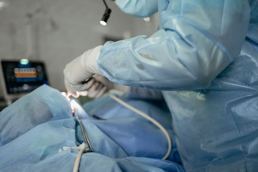 Hernia repair surgery with mesh placement in operating theatre